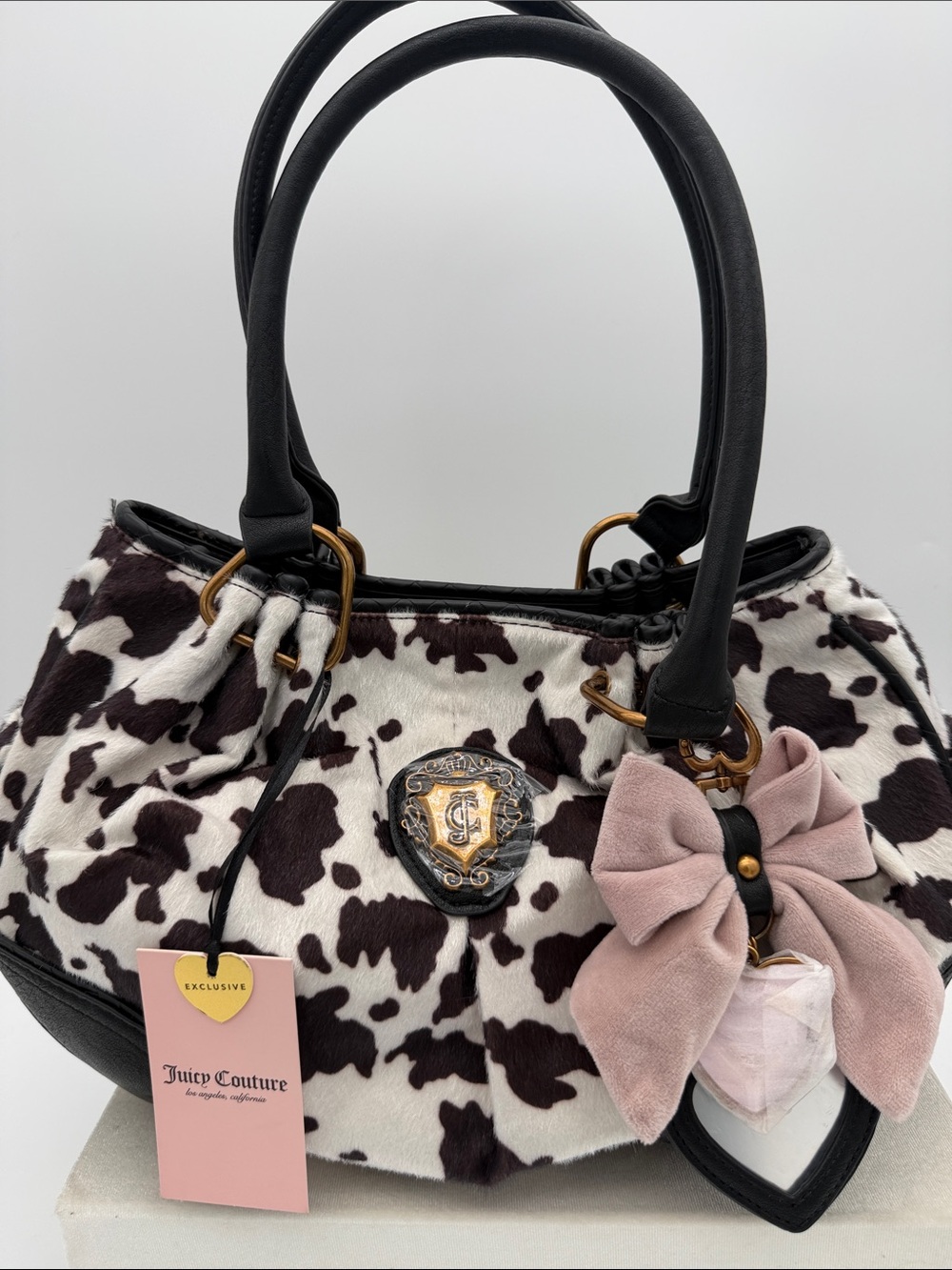 Juicy Couture Black & White Cowhide Print Satchel with Pink Bow Charm